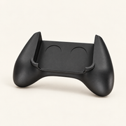Black Retro Kid hand grip shown without a console on a cream studio background.